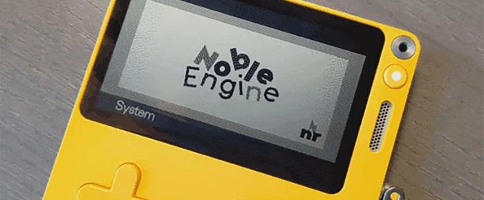 A photo of a Playdate displaying the Noble Engine logotype.